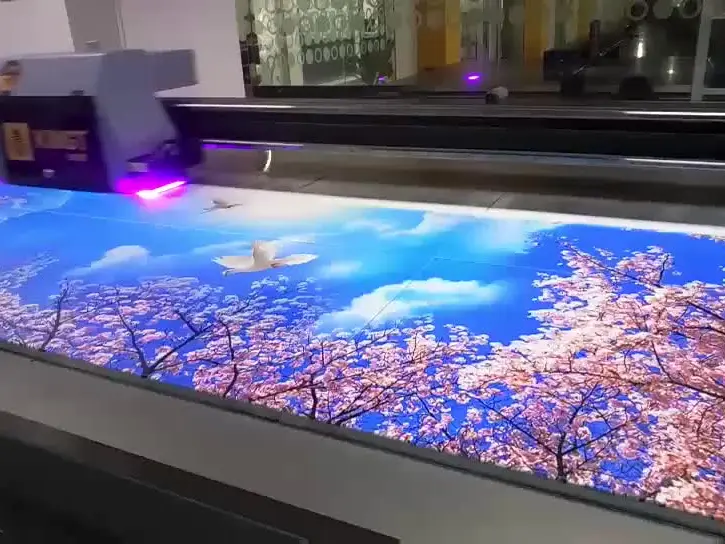 Flatbed UV printing machine producing vibrant, high-resolution prints on acrylic.